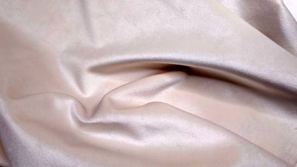 istock Velvet fabric close-up with details, beige. 1818659529