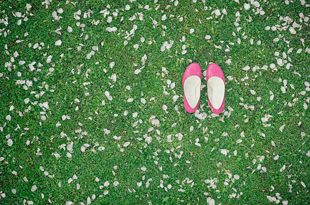 In the park. Pink sneakers and green clover