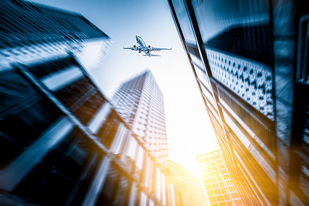 istock Skyscrapers with airplane 181866360