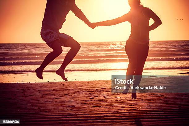 Taking A Leap Stock Photo - Download Image Now - Adult, Adults Only, Back Lit