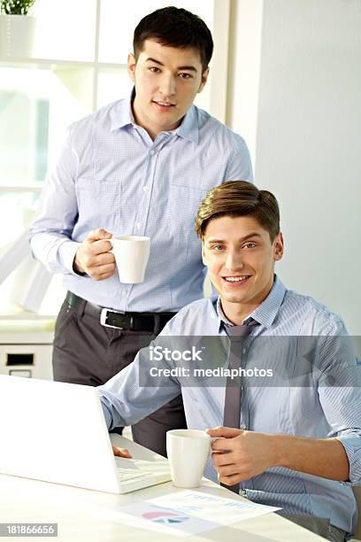 Working In Team Stock Photo - Download Image Now - 20-24 Years, Adult, Adults Only