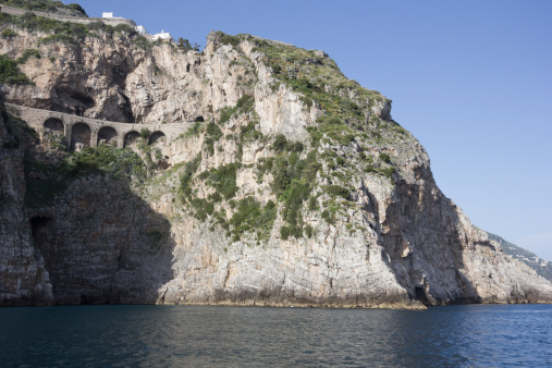 This image shows the feat of engineering that led to the coastal road on the Amalfi Coast being built into the dramatic rock faces