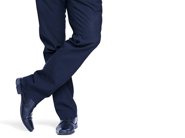 Welldressed man standing relaxed wearing black on white stock photo