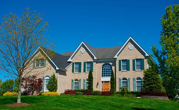 istock Curbside view of a large luxurious home 181868032