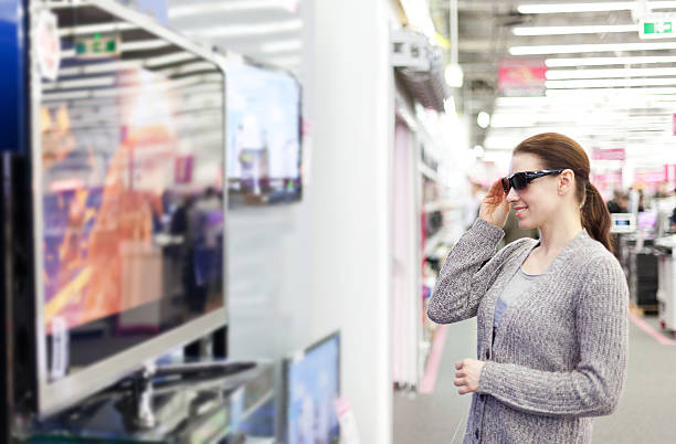 istock woman buys a 3D TV 181868035