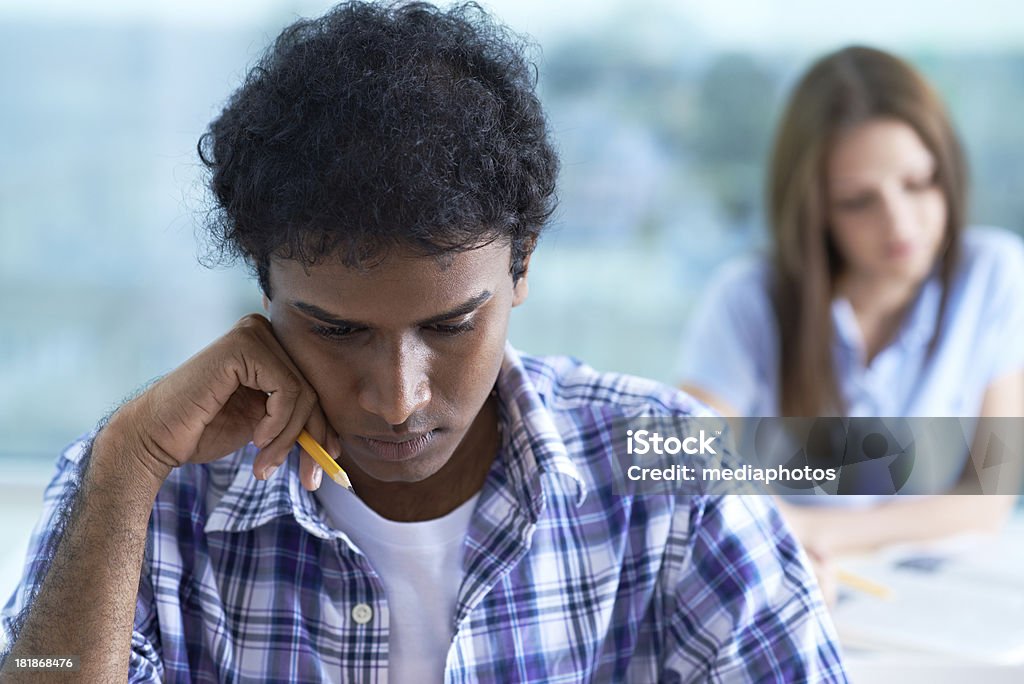 Student at work Serious male student concentrating at work 20-24 Years Stock Photo