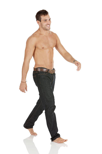 istock Happy shirtless man walking 181868835