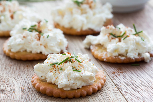 Salticrax with a cottage cheese topping "Salticrax, South African cracker topped with cottage cheese with a sprinkling of cayenne pepper" cottage cheese photos stock pictures, royalty-free photos & images