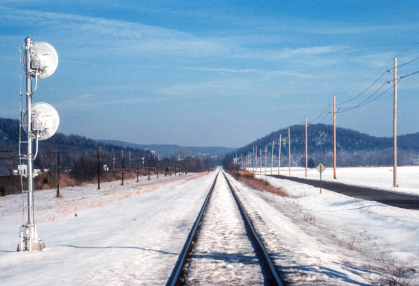 Trains in Snow - Rails Looking East - 2001. Scanned from Kodachrome 64 slide.