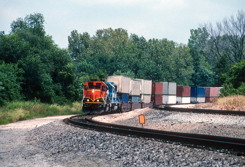 A high vantage viewpoint of a large-scale commercial inland cargo container and railroad yard in Cincinnati Ohio.  It is a major distribution center.