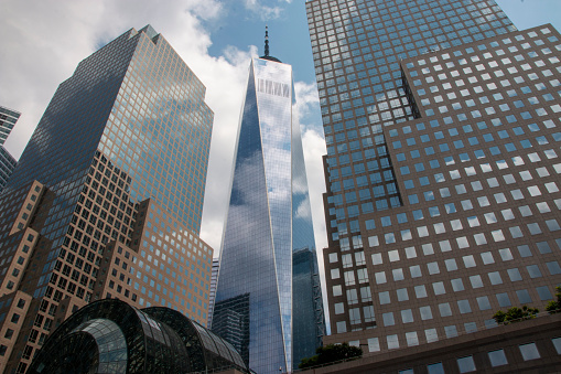 A group of tall buildings in a New York City surrounding the Freedom Tower.