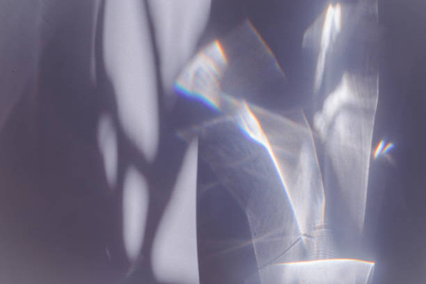 istock Sunlight background, abstract photo with light and shadow, glare and shine on paper texture, rainbow flare from sun, gray blue minimal aesthetic fon. Natural light and caustic effects. 1818698821