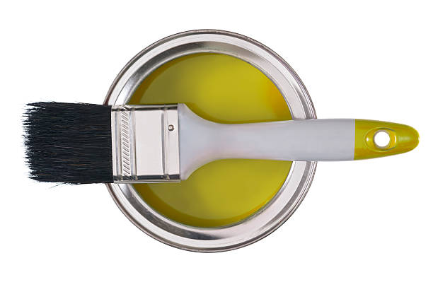 istock Paint brush on a tin of yellow paint 181870321