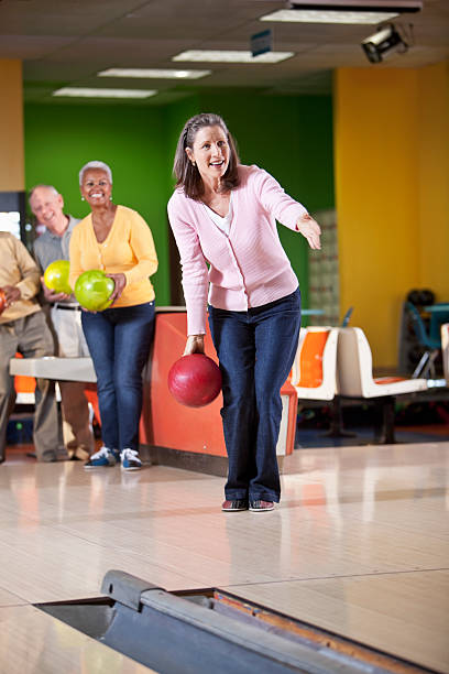 istock Woman bowling with friends 181870566