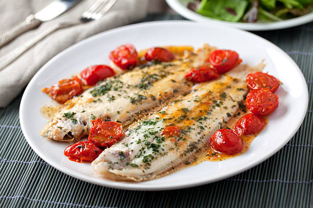Sole with cherry tomatoes stock photo