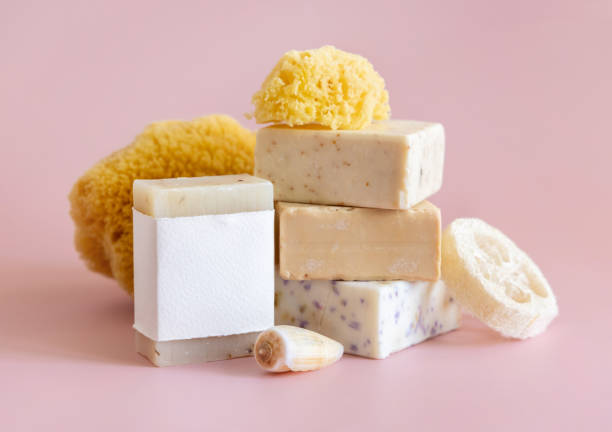 istock Soap bars with blank label, natural sponge and seashell on pink close up, mockup 1818711619