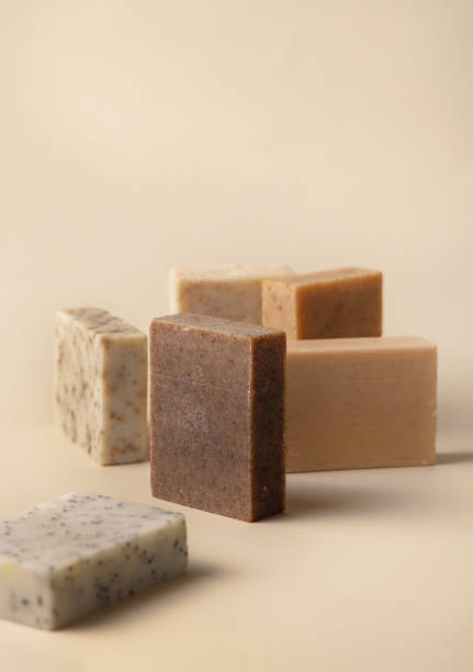istock Natural herbal beige and brown soap bars on light beige close up 1818711639