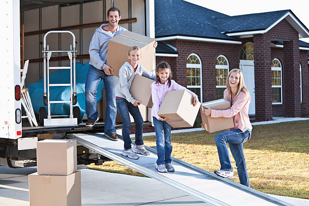 istock Family moving house, unloading truck 181871459