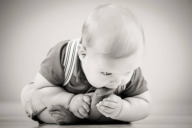 Little boy eating his own sock