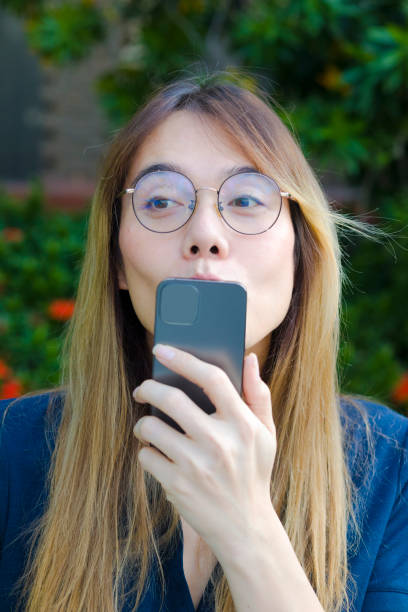 istock Surprised Thai transgender kissing mobile phone 1818729379