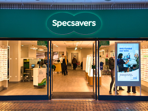 The frontage of a branch of optical retail chain Specsavers. The company sells glasses, sunglasses, contact lenses and also hearing aids.