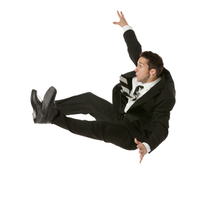 Side view of a businessman falling down
