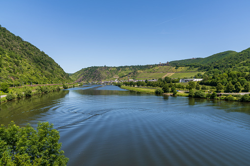 Alken, Rhineland-Palatine, Germany - June 14, 2021: The Moselle River with Castle Thurant and the village of Alken