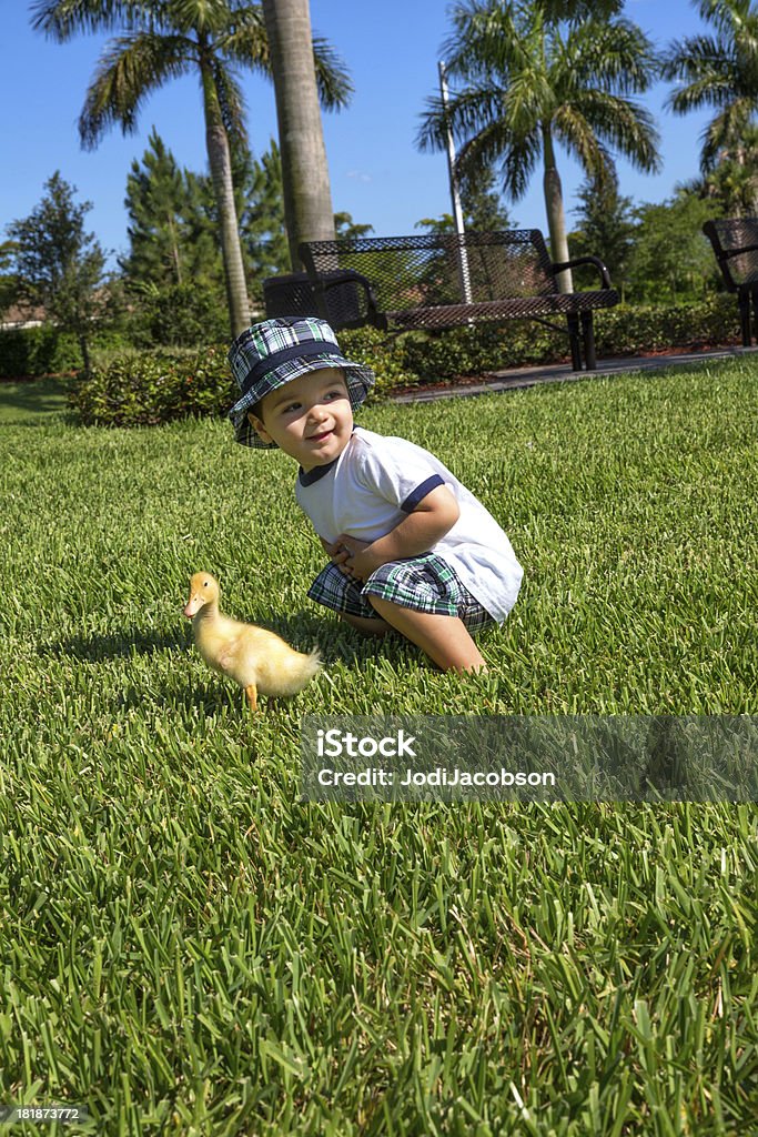 Happy boy wearing a flap cap Happy boy wearing a flap cap.  rrChildren images 12-17 Months Stock Photo