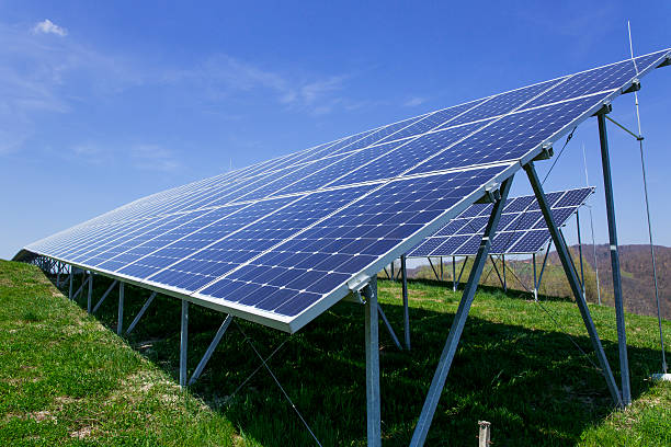istock Solar panels on a sunny day against clear blue sky 181873783