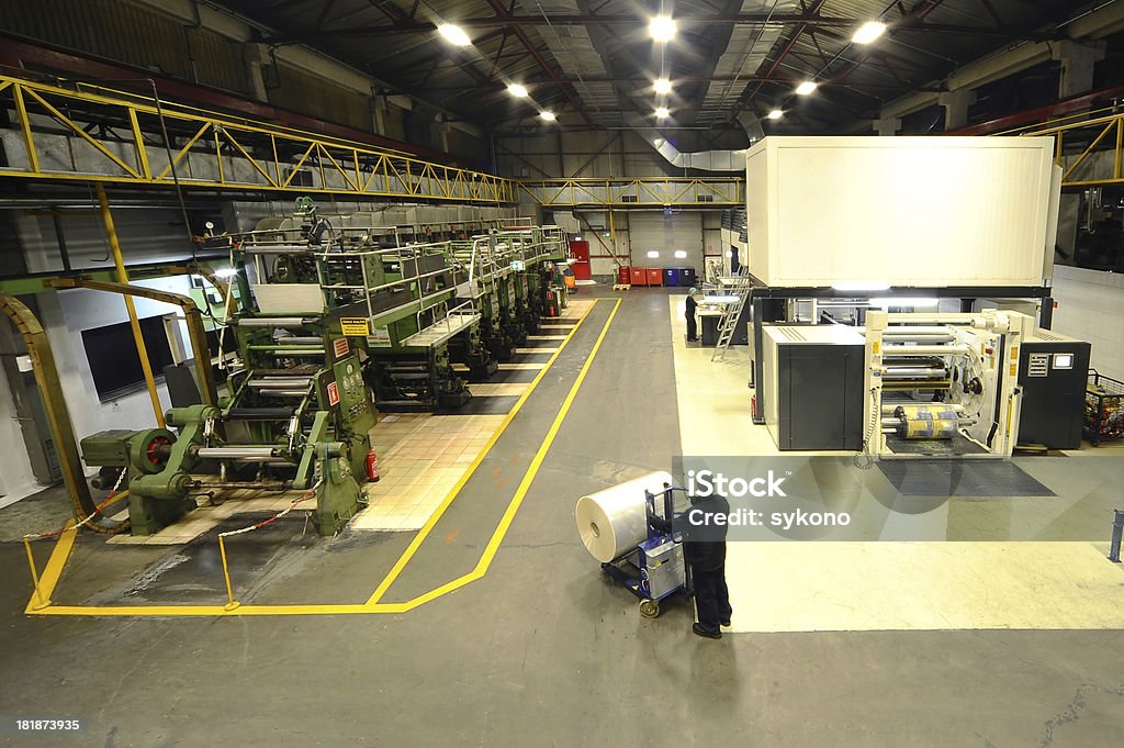 Big printing plant Big printing plant with large printing presses Printing Press Stock Photo