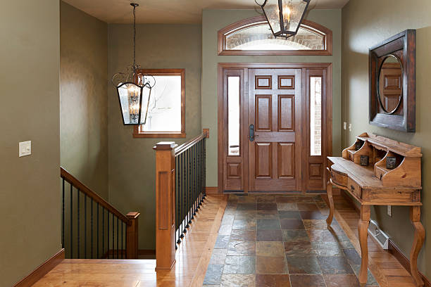 istock Warm Home Foyer With Hardwood and Tile Floor 181874207