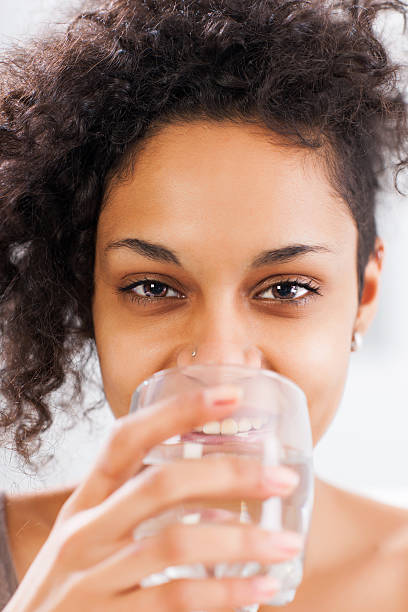 istock Beautiful woman drinking water. 181874443