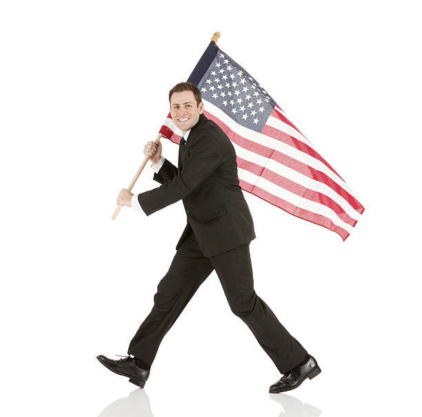 istock Businessman walking with american flag 181874568