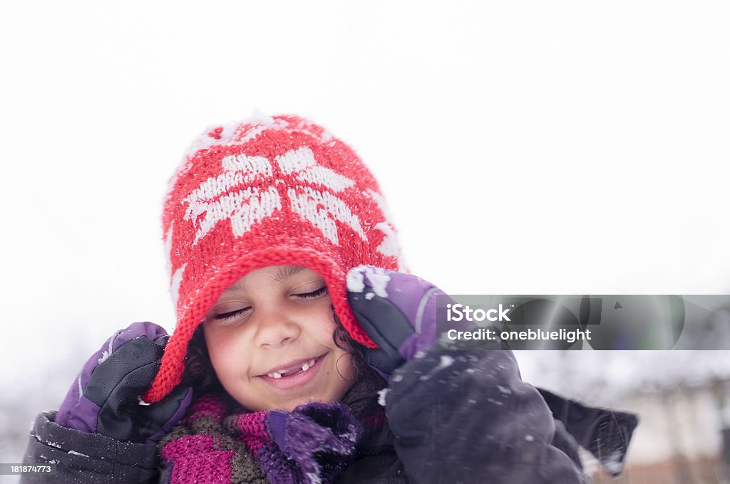 Girl (6-7) Playing in The Snow Royalty free stock photo of child playing in the snow. 6-7 Years Stock Photo