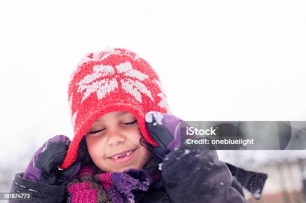 Girl Playing In The Snow Stock Photo - Download Image Now - 6-7 Years, African Ethnicity, Brown Eyes