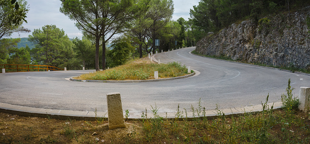 Hairpin turn on an empty mountain road in Croatian Countryside