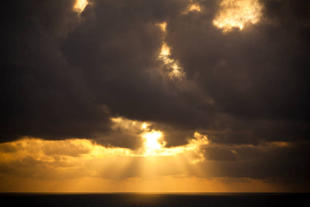 istock heavenly scene of dramatic sky and golden rays 181875203