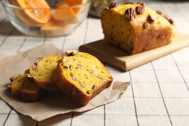istock Delicious pumpkin bread with pecan nuts on tablecloth 1818757810