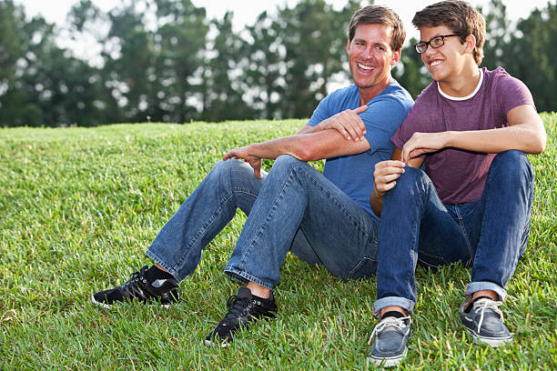 Mature man (40s) hanging out with teenage son (15 years).