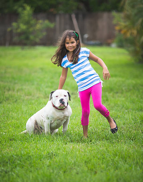 istock little girl and dog 181875984