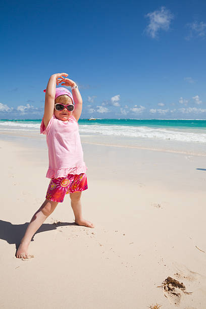 Little girl at the beach in Dominican Republic stock photo