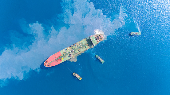 Top view Ship tanker oil Aerial view Liquefied Petroleum  tanker, Tanker ship logistic and transportation business oil and gas industry, Loading  oil and gas offshore platforms. capacity approaching the port by a tugboat occupying the port