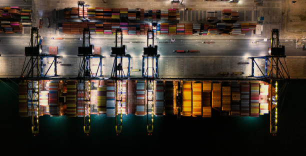 istock Top view Logistics and transportation of Container Cargo ship and Cargo plane with working crane bridge in shipyard at sunrise, logistic import export and transport industry background 1818773993