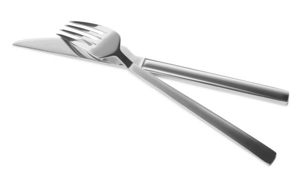 istock Fork and knife isolated on white. Stylish shiny cutlery set 1818773995