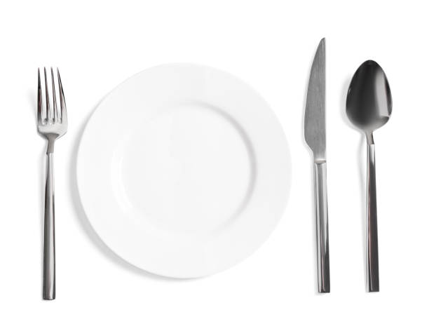 istock Clean plate and shiny cutlery on white background, top view 1818775064