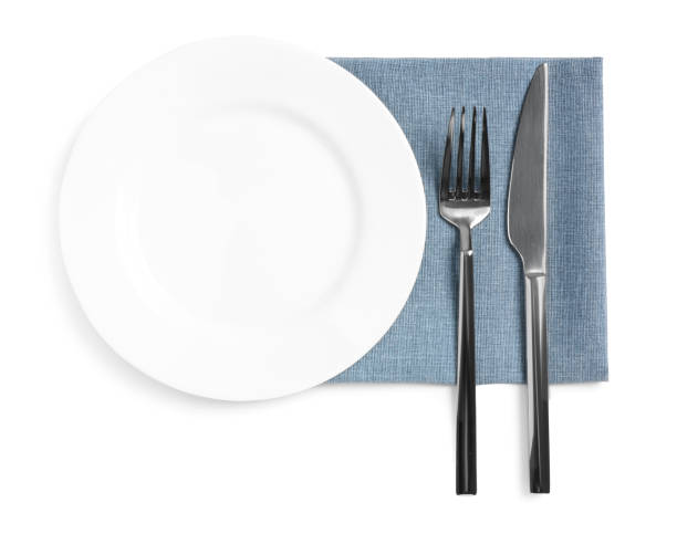 istock Clean plate and shiny cutlery on white background, top view 1818776110