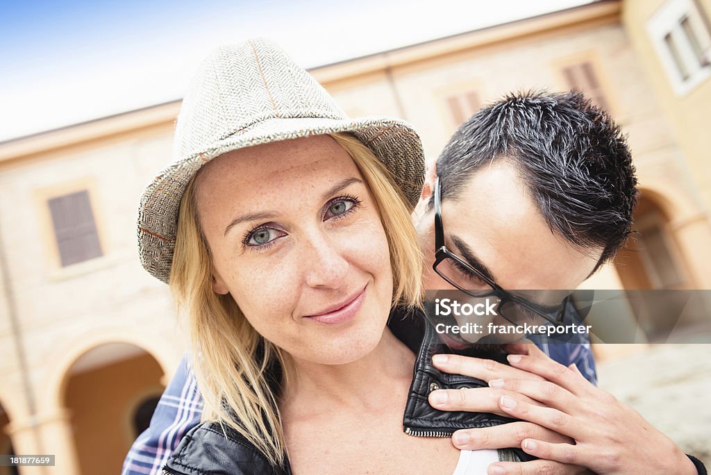 Couple smiling outdoors embraced  20-29 Years Stock Photo