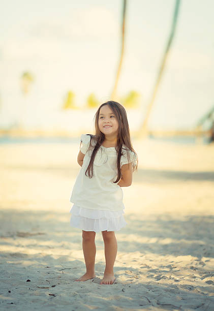 istock little girl on the beach 181877812