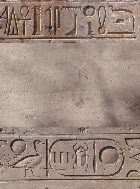 istock Vertical background with ancient Egyptian hieroglyphs on stone wall, Egypt, Africa. Backdrop with sandstone carving with hieroglyph. Mock up template. Copy space for text 1818785739