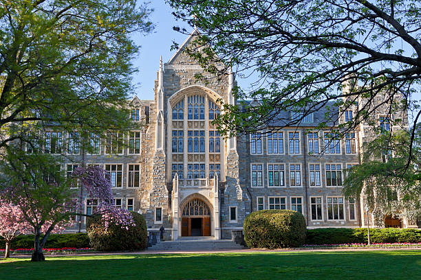 Front view of the Georgetown University in Washington "White-Gravenor Hall of the Georgetown University, Washington DC, lit by an early evening sun." healy hall stock pictures, royalty-free photos & images